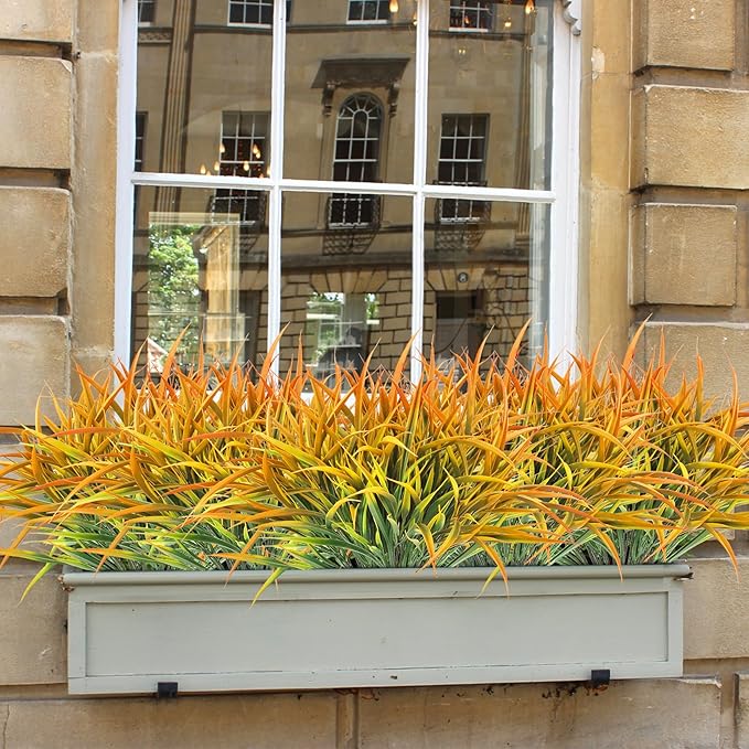 Ouddy Decor 16 Bundles Artificial Fall Plants Outdoor Fake Grass Stems UV Resistant Faux Plastic Plants Shrubs for Autumn Home Garden Pathway Farmhouse Front Porch Harvest Thanksgiving Decor, Orange