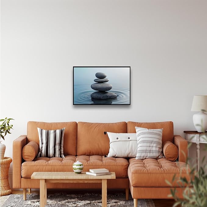 Zen wall art Harmonious grey stones stacked on a calm surface of water Serene Zen decor suitable for tranquil homes and spaces of meditation 24x36in Metal blackFramed