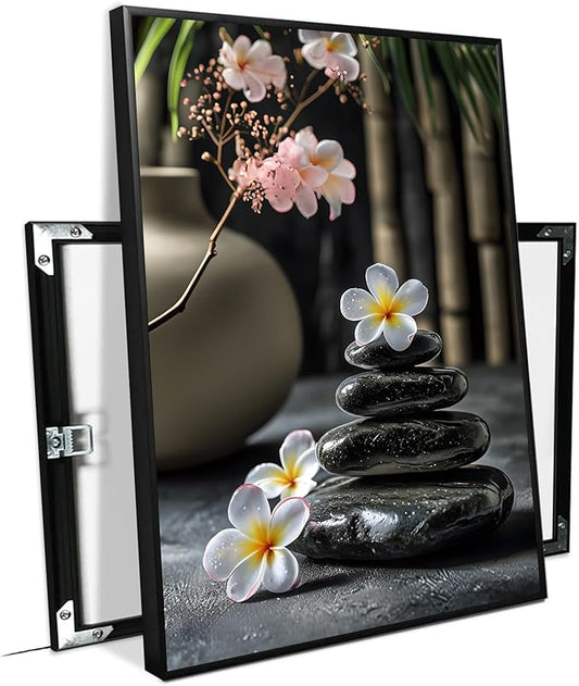 A harmonious black stone stack paired with white and pink flowers bamboo and ceramic vases creates a tranquil Zen decor for minimalist homes and mindful spaces 20x30in Metal blackFramed