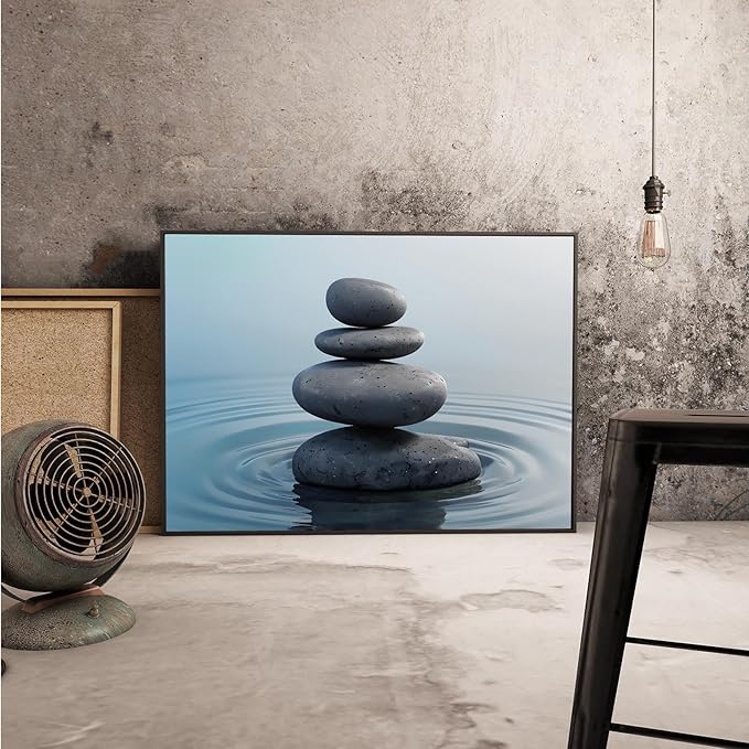 Zen wall art Harmonious grey stones stacked on a calm surface of water Serene Zen decor suitable for tranquil homes and spaces of meditation 24x36in Metal blackFramed